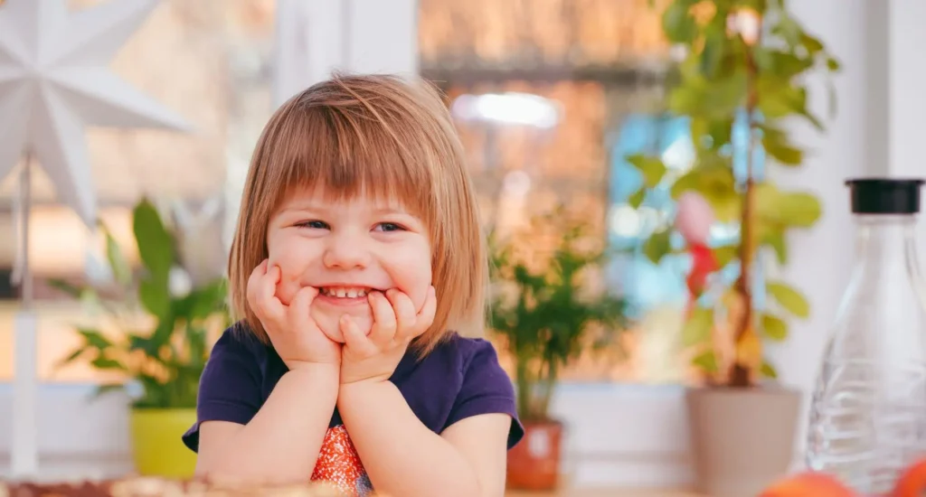 Child enjoying time in a welcoming early years setting with a nature-inspired environment.