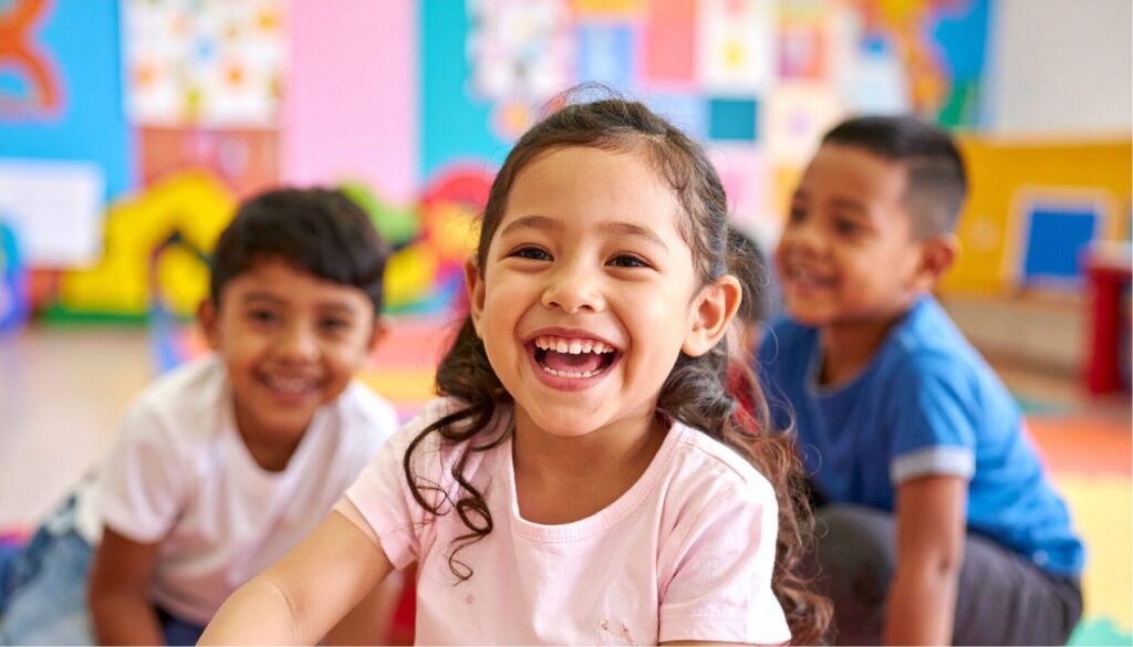 Children enjoying interactive learning activities in a vibrant nursery and preschool classroom.